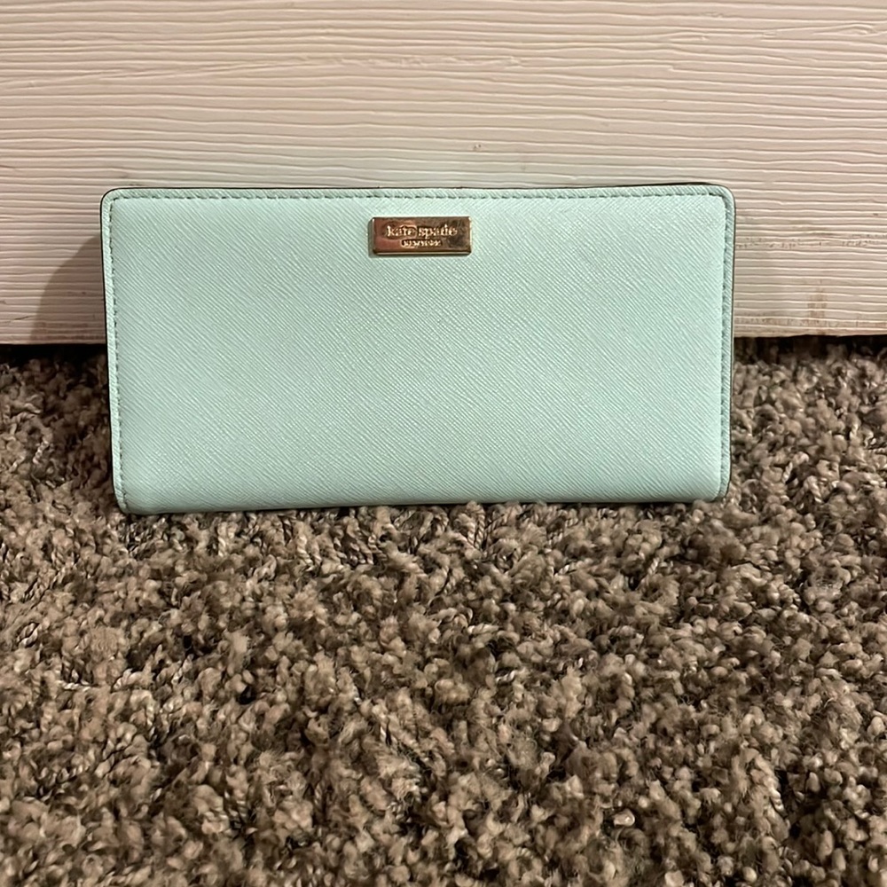 moderately worn light blue kate spade wallet